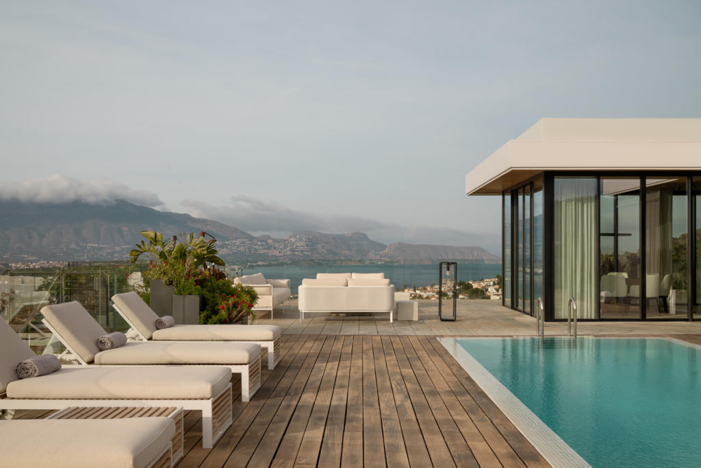 Private terrace with a pool for your health retreat at SHA Spain, featuring sun loungers and panoramic views of the Mediterranean and the Sierra de Altea.